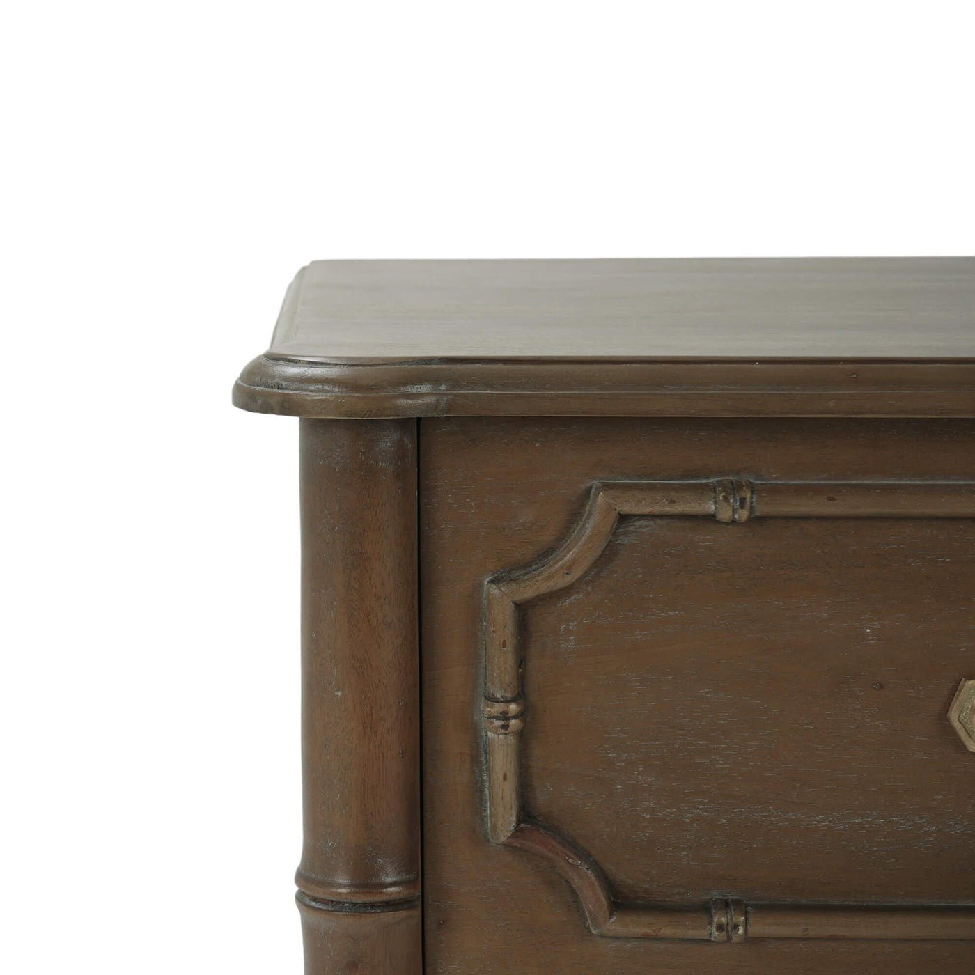 Close-up of faux bamboo end table corner design.