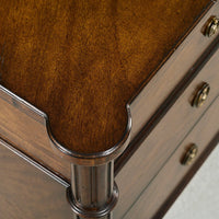 Dark French Louis XVI commode, close-up of corner detail.