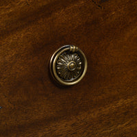Dark French Louis XVI commode, close-up of drawer handle.