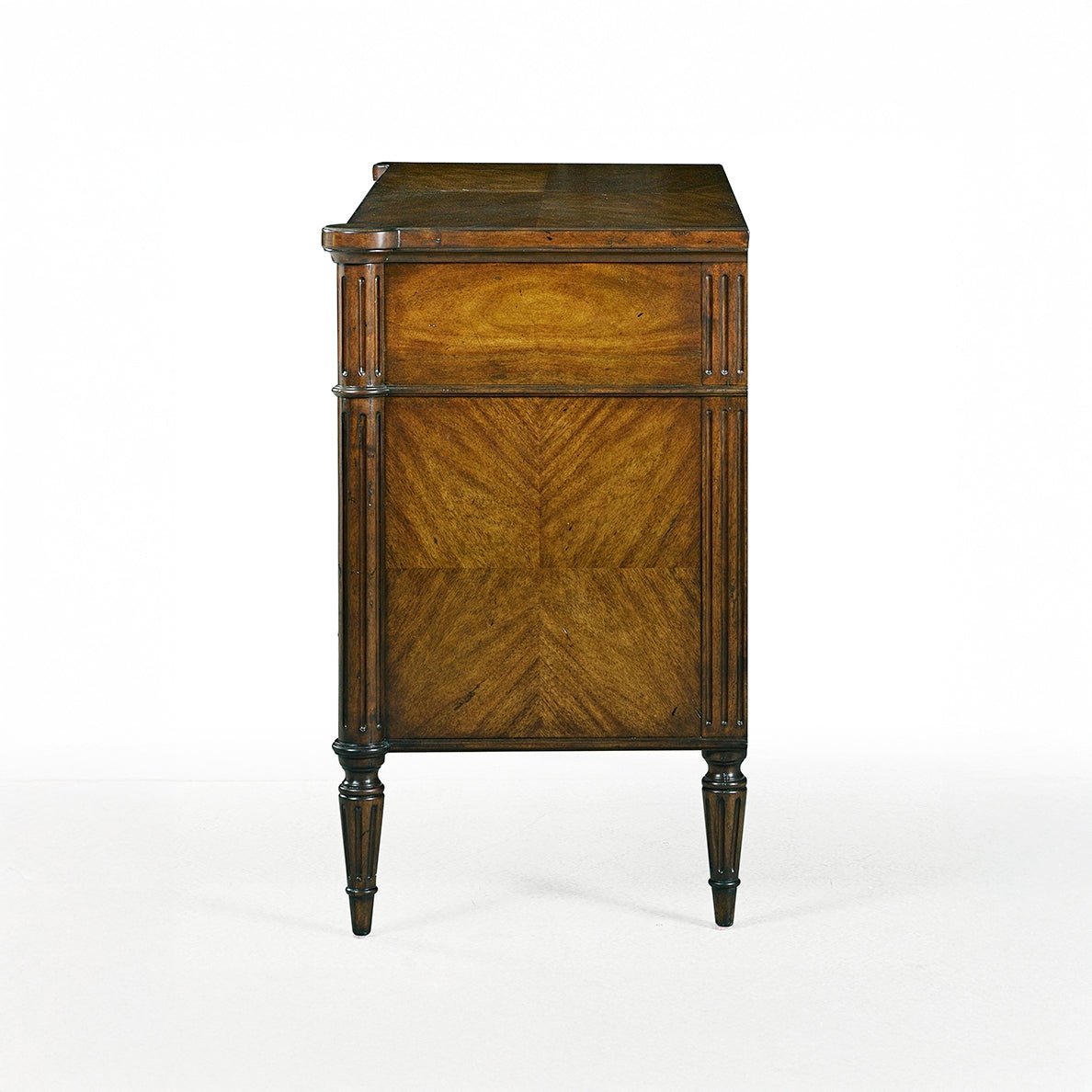 Dark French Louis XVI commode, side view detailing wood finish.