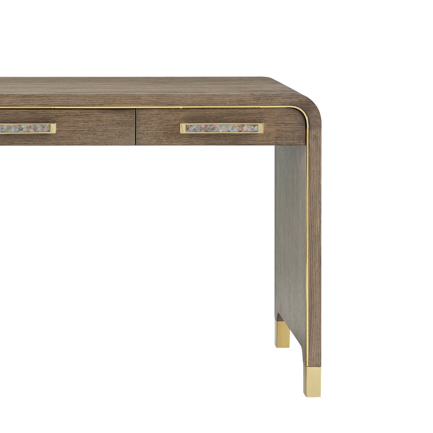 Close-up of desk corner showing wood grain and brass trim.
