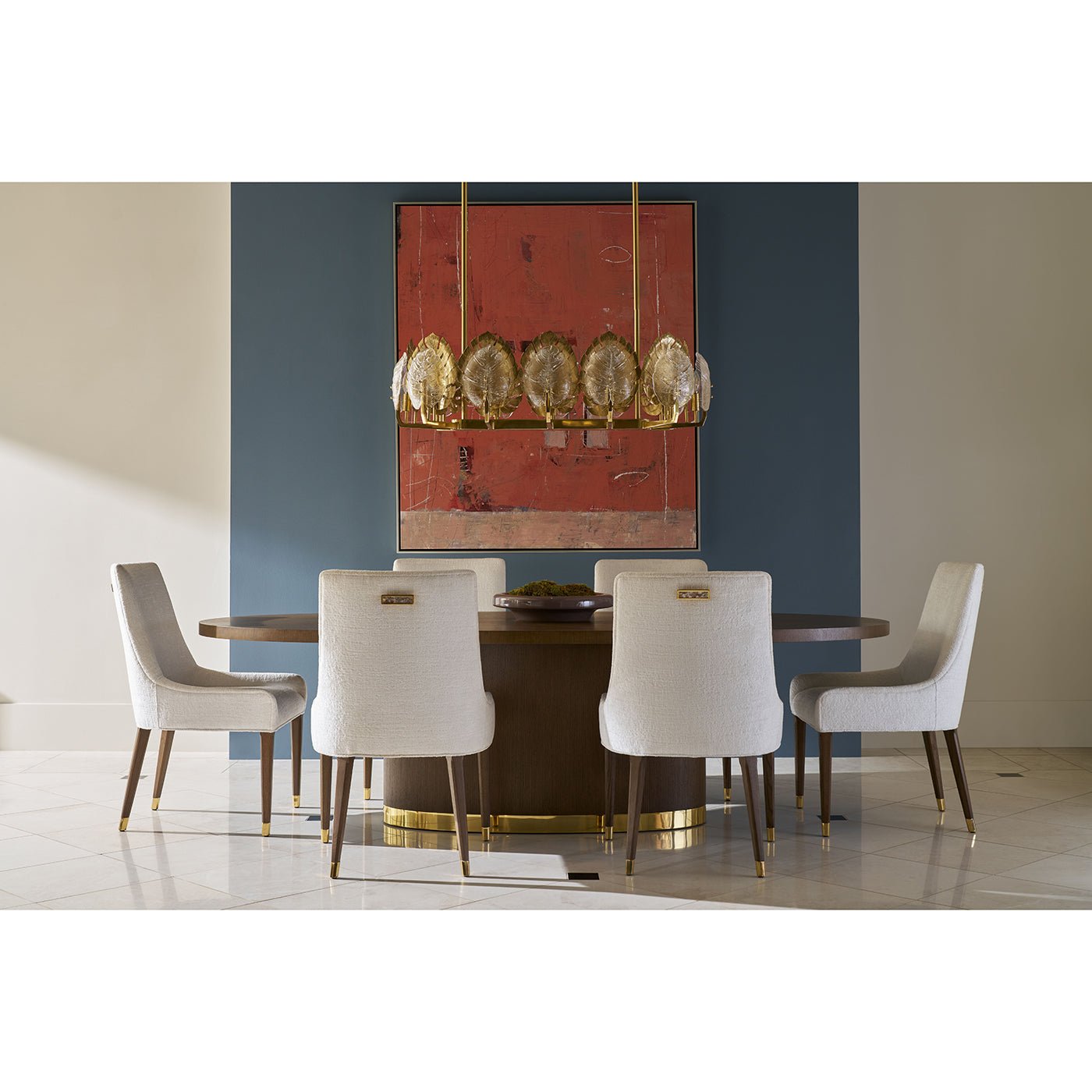 Dining room setup with oval wood table and chairs.