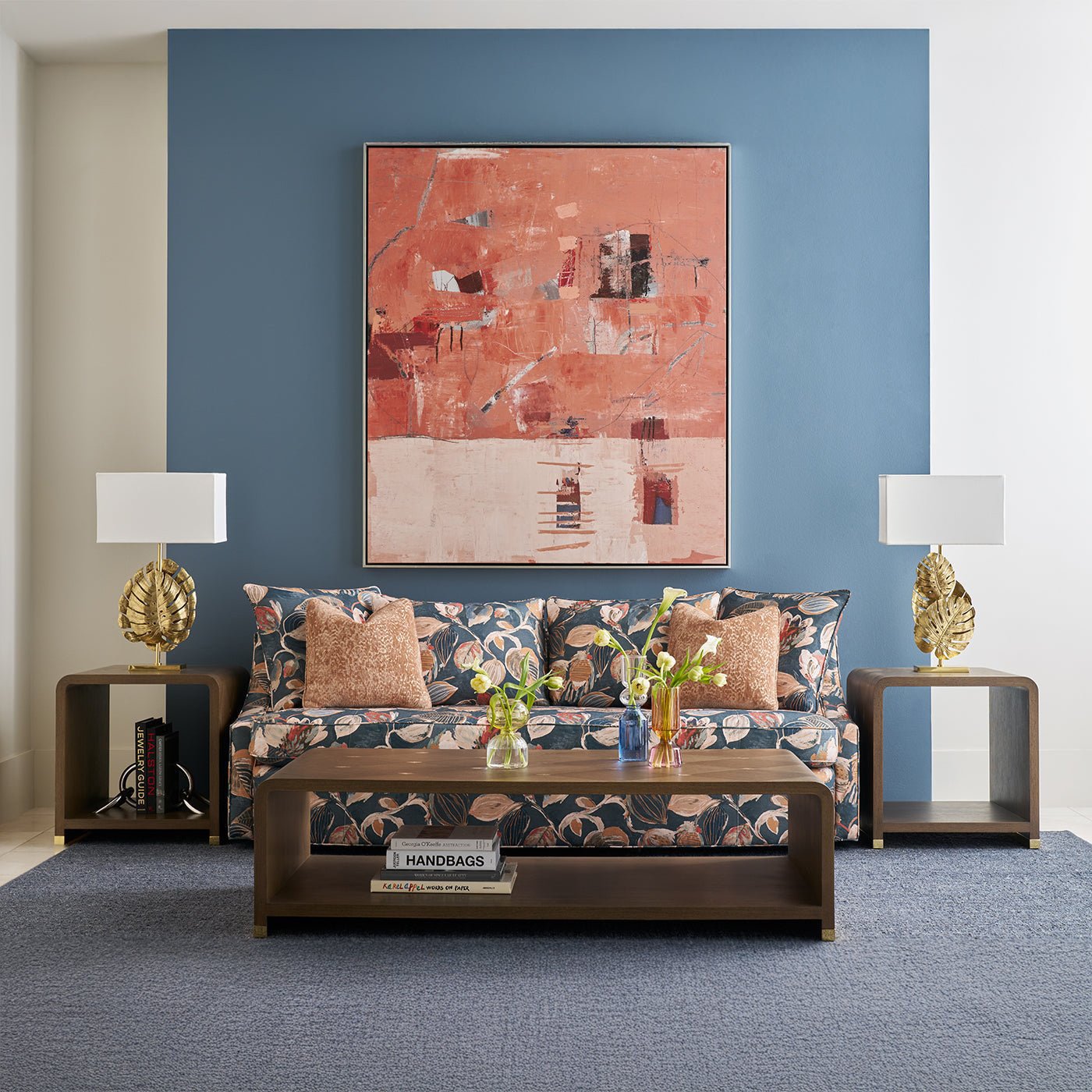 Living room with sofa, side tables, and lamps.
