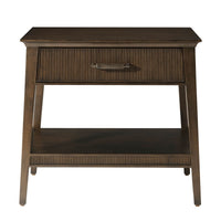 Front view of dark mid-century nightstand with closed drawer.