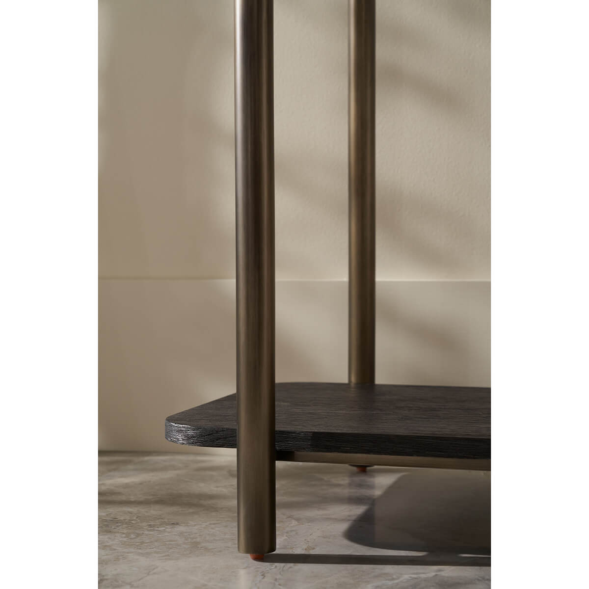 Close-up of dark oak console table leg and shelf.