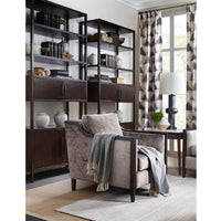 Dark open bookcase in stylish living room setup.