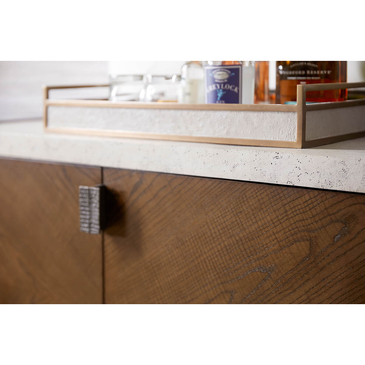 Close-up with items on dark modern storage console.