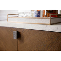 Close-up with items on dark modern storage console.