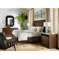 Bedroom setup with dark modern nightstand and furniture.
