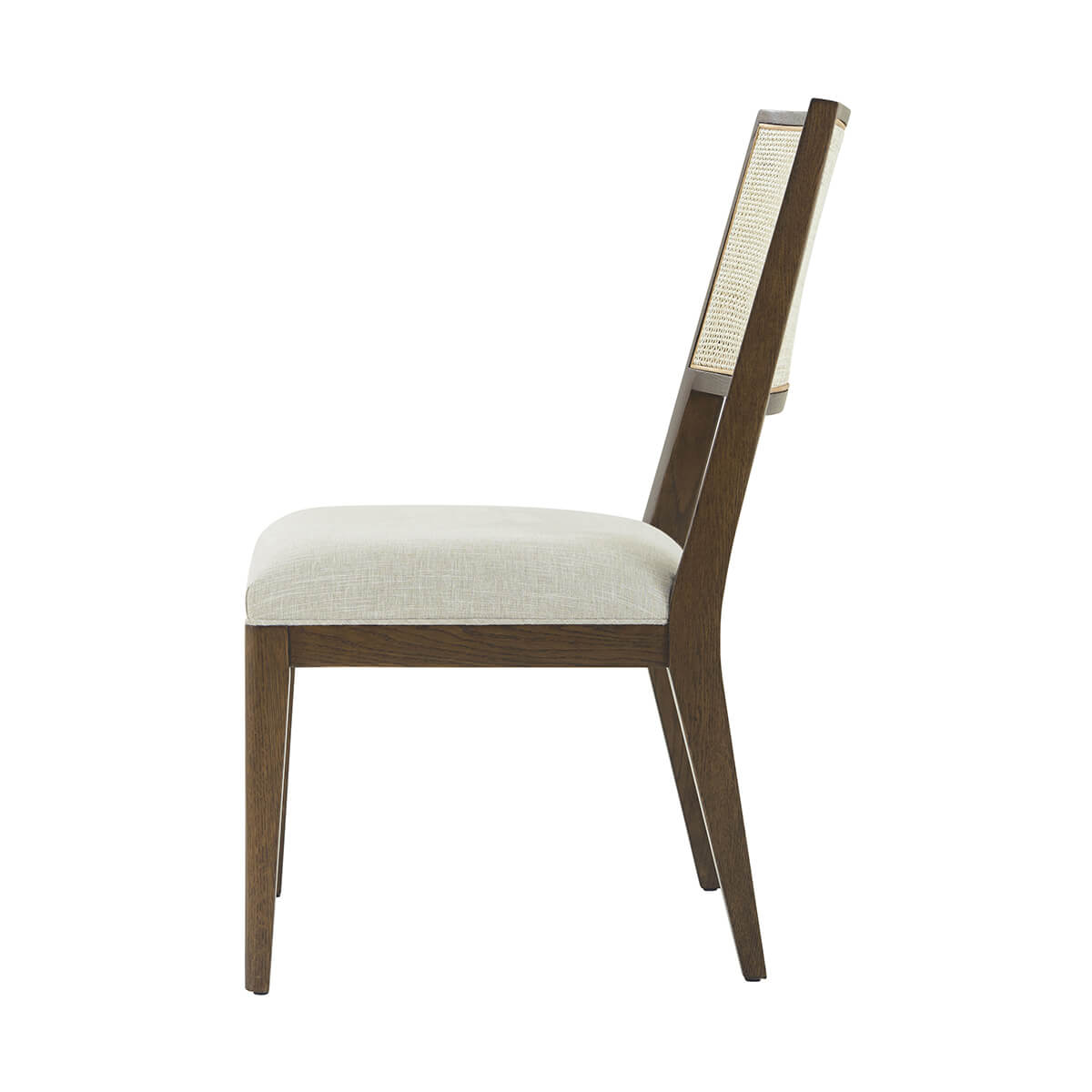 Side profile of dark oak dining chair.