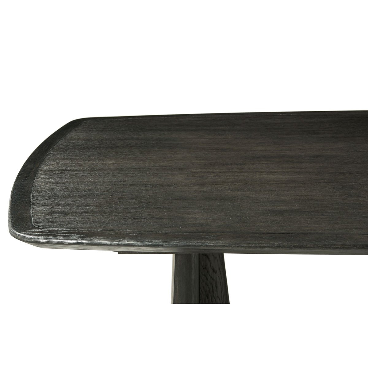 Dining table corner, dark oak close-up.