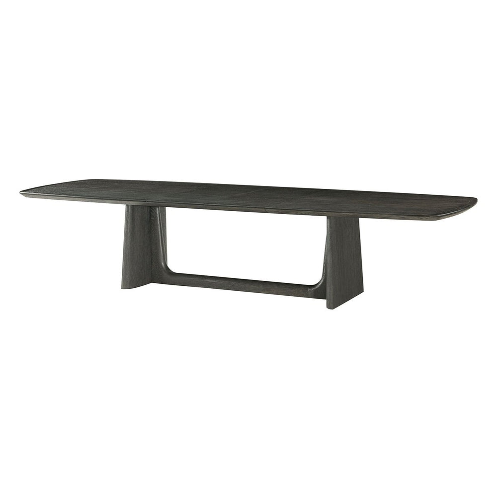 Dark oak dining table, angled side view.