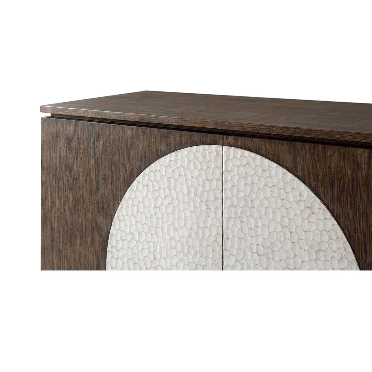 Close-up of top and circular front design on cabinet.