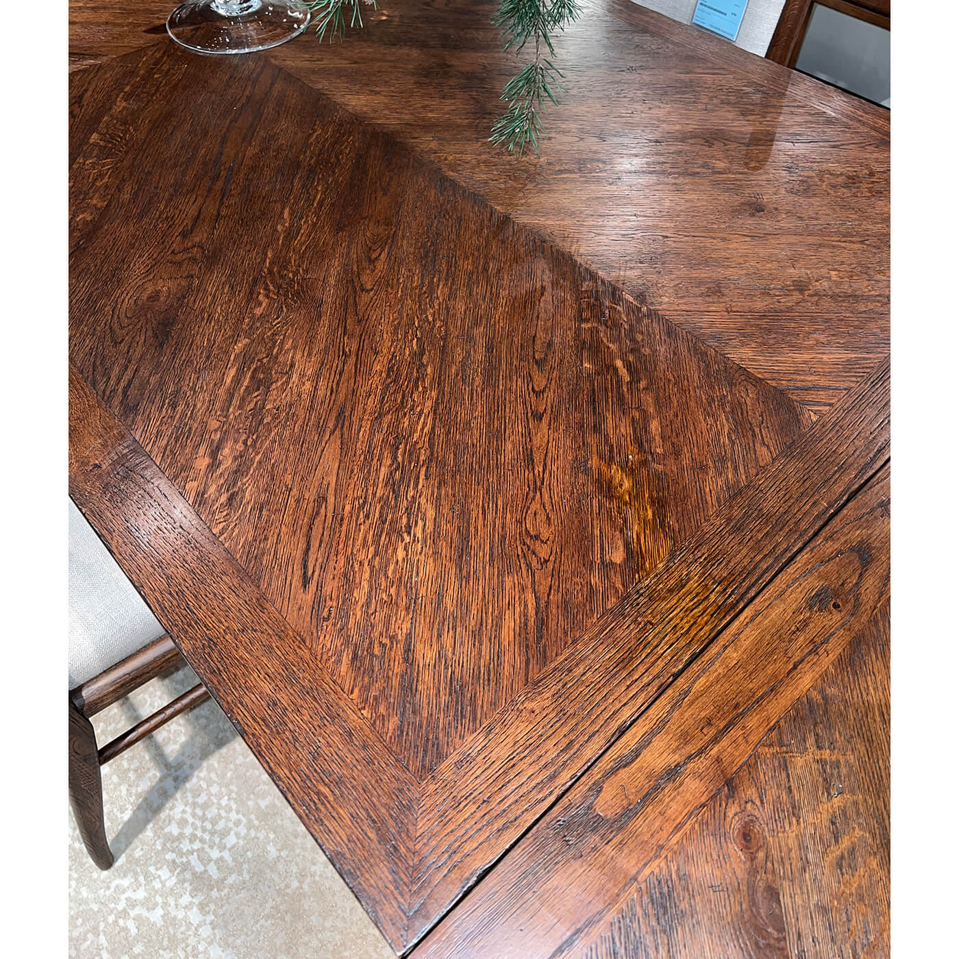 Close-up of dark oak parquetry pattern on table.