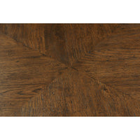 Dark oak parquetry detail on dining table surface.