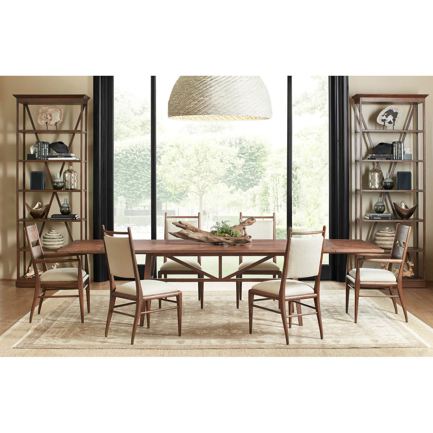 Dining table in a room setting with chairs.