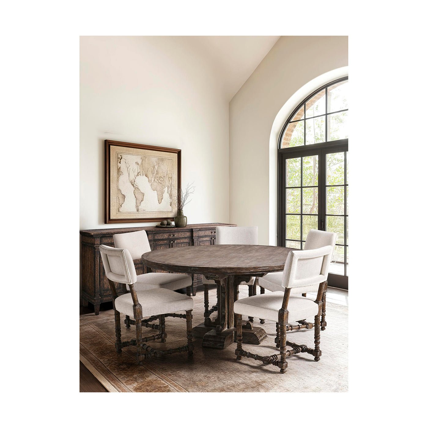 Dining room setup, chairs around wooden table.