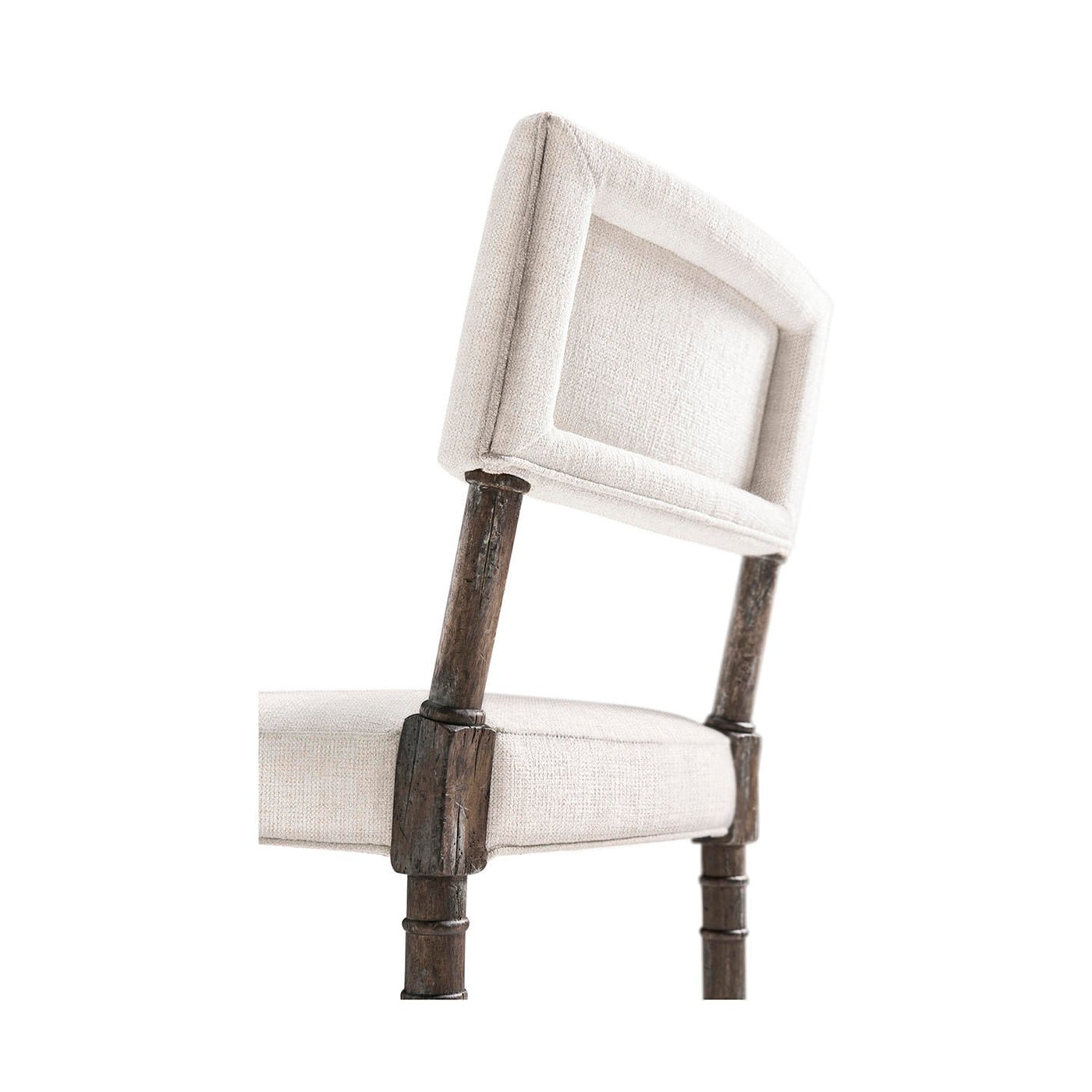Upholstered backrest detail on farmhouse side chair.