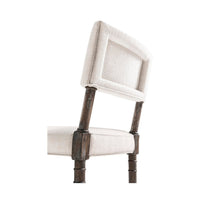 Upholstered backrest detail on farmhouse side chair.