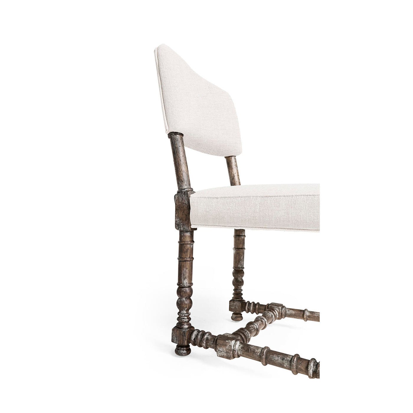 Close-up of chair's detailed wooden legs.