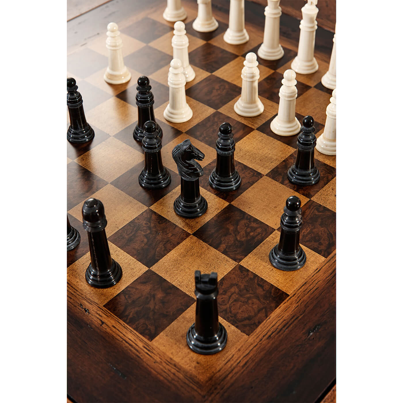 Chess pieces in play on game table.