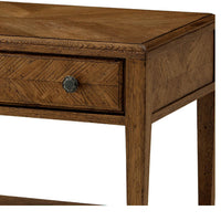 Close-up of drawer and knob on oak end table.