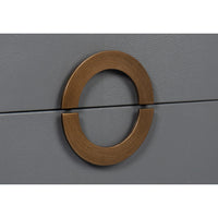 Close-up of circle handle on dark silver nightstand.