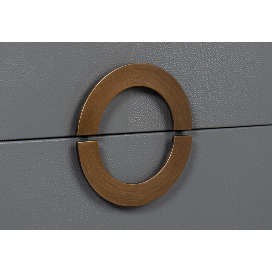 Close-up of circle handle on dark silver nightstand.