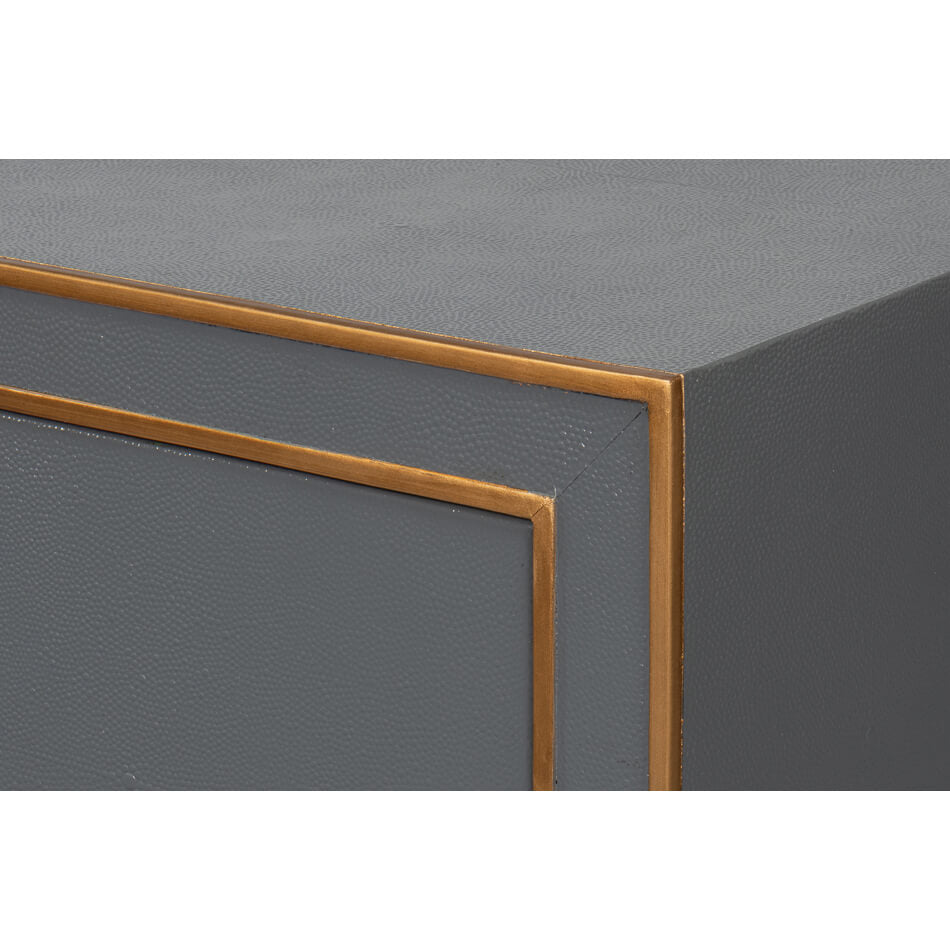 Close-up of gold trim on dark silver nightstand.