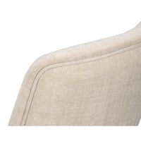 Detailed view of upholstered edge on dining chair.
