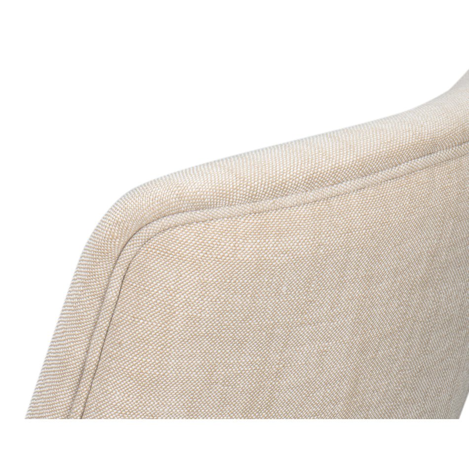 Detailed view of upholstered edge on dining chair.