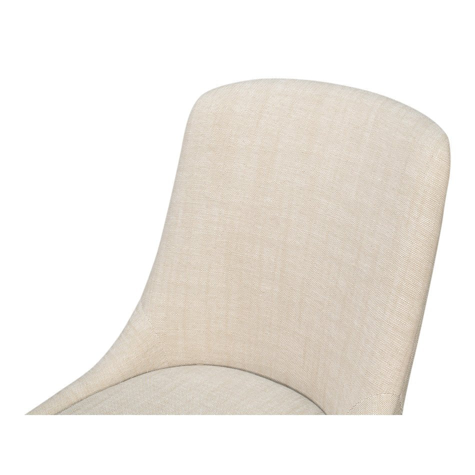 Close-up of beige upholstered dining chair backrest.