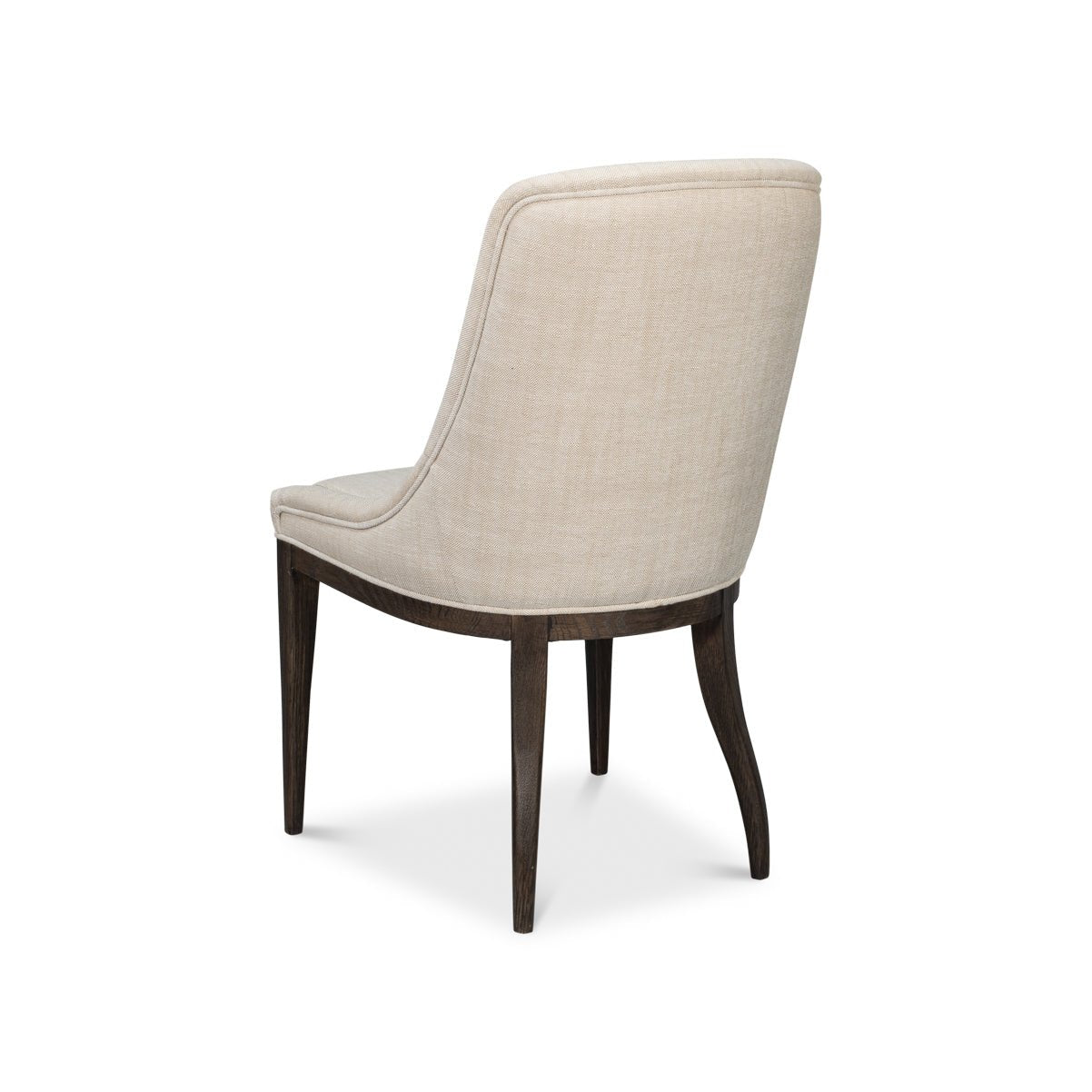 Beige upholstered dining chair, three-quarter rear view.