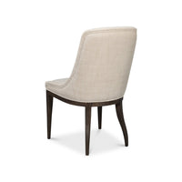 Beige upholstered dining chair, three-quarter rear view.