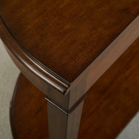 Dark wood console table corner close-up.