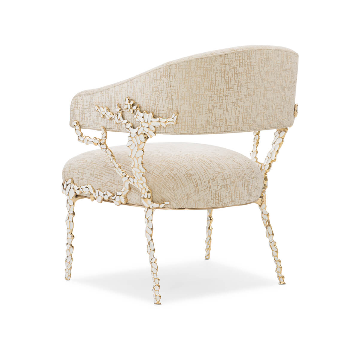 Back angled view of beige modern accent chair, ornate legs.