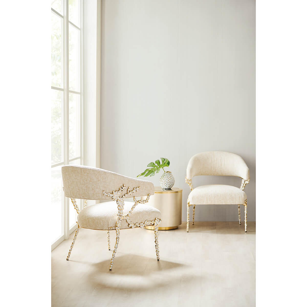 Two modern accent chairs by window, minimalist decor.