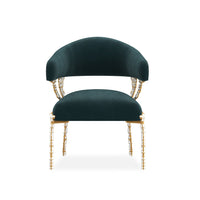 Modern blue velvet chair front view showcasing smooth curves.