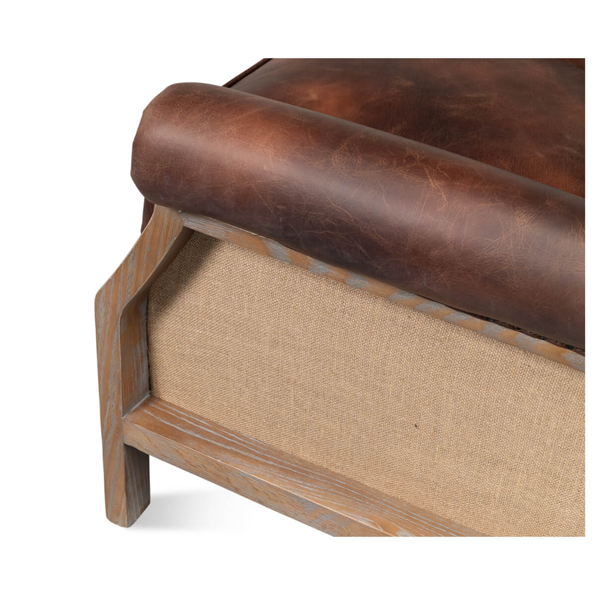 Cushion edge detail of leather club chair with fabric side.
