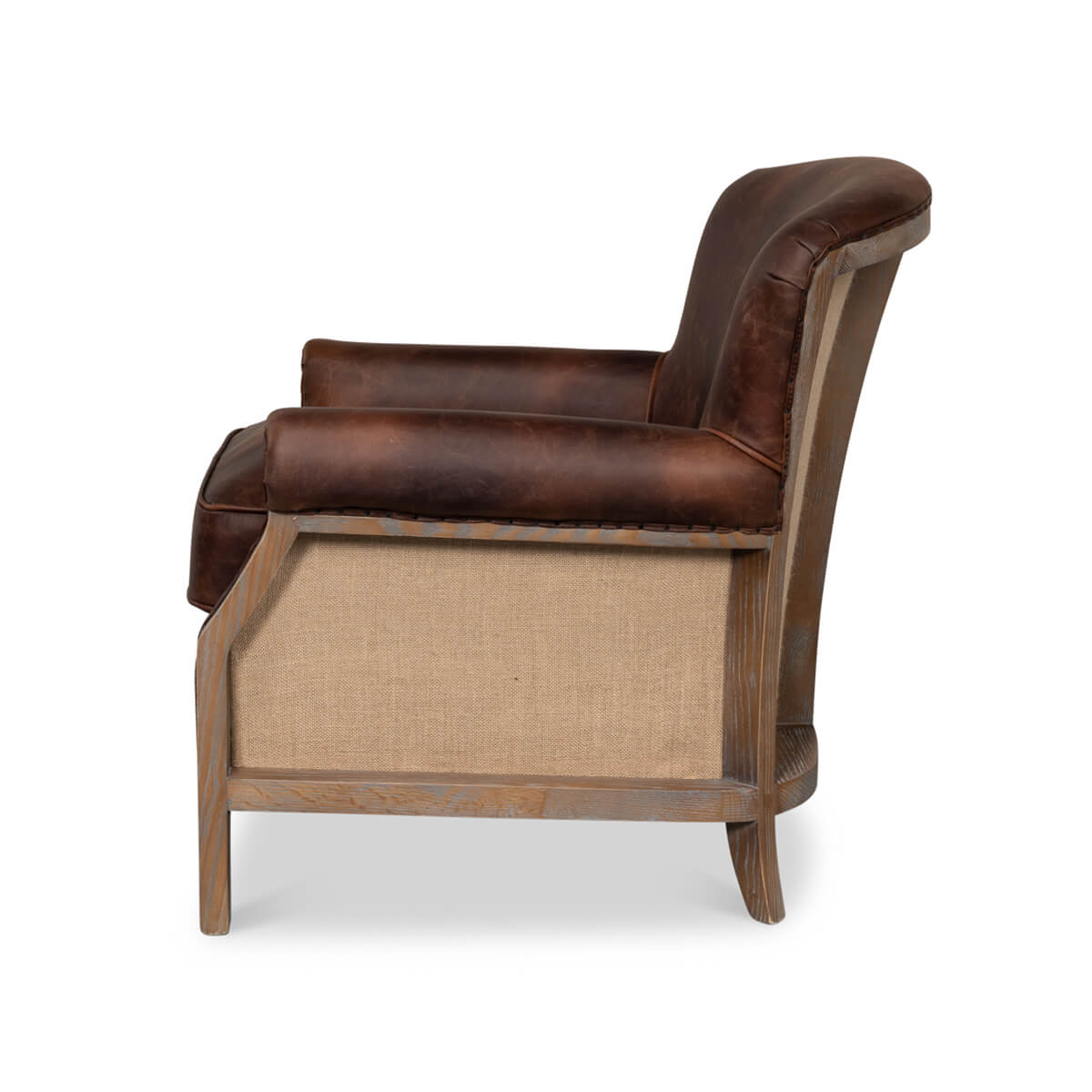 Side profile of leather club chair with fabric panel.