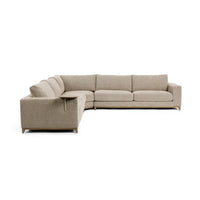 Angled view of beige sectional showing the round arm-side table, seat cushions and wood base