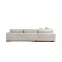Rear view of sand sectional with upholstered back panels and exposed wood base
