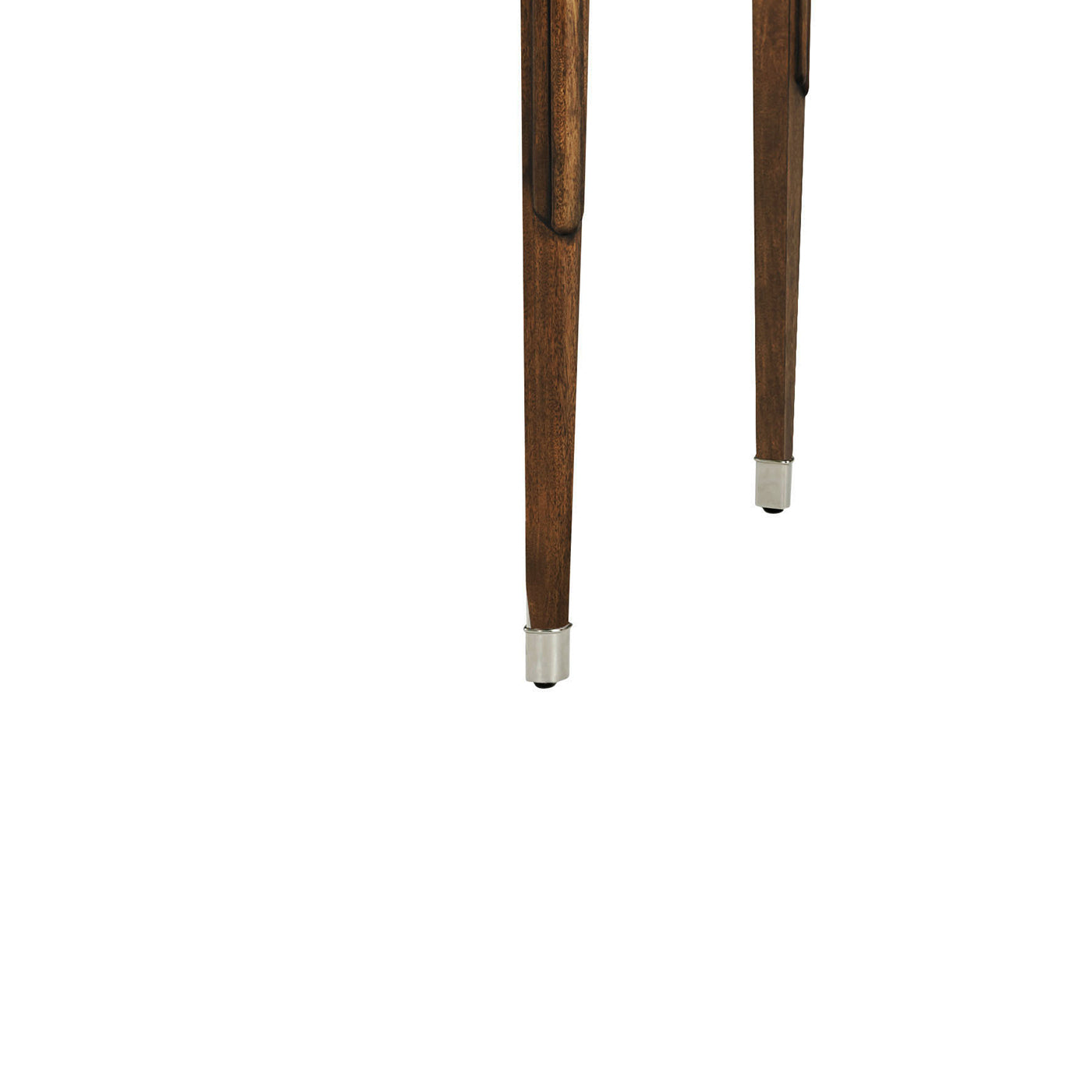 Close-up of walnut desk leg with metal cap.