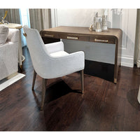 Desk and chair on dark wooden floor, room interior setup.