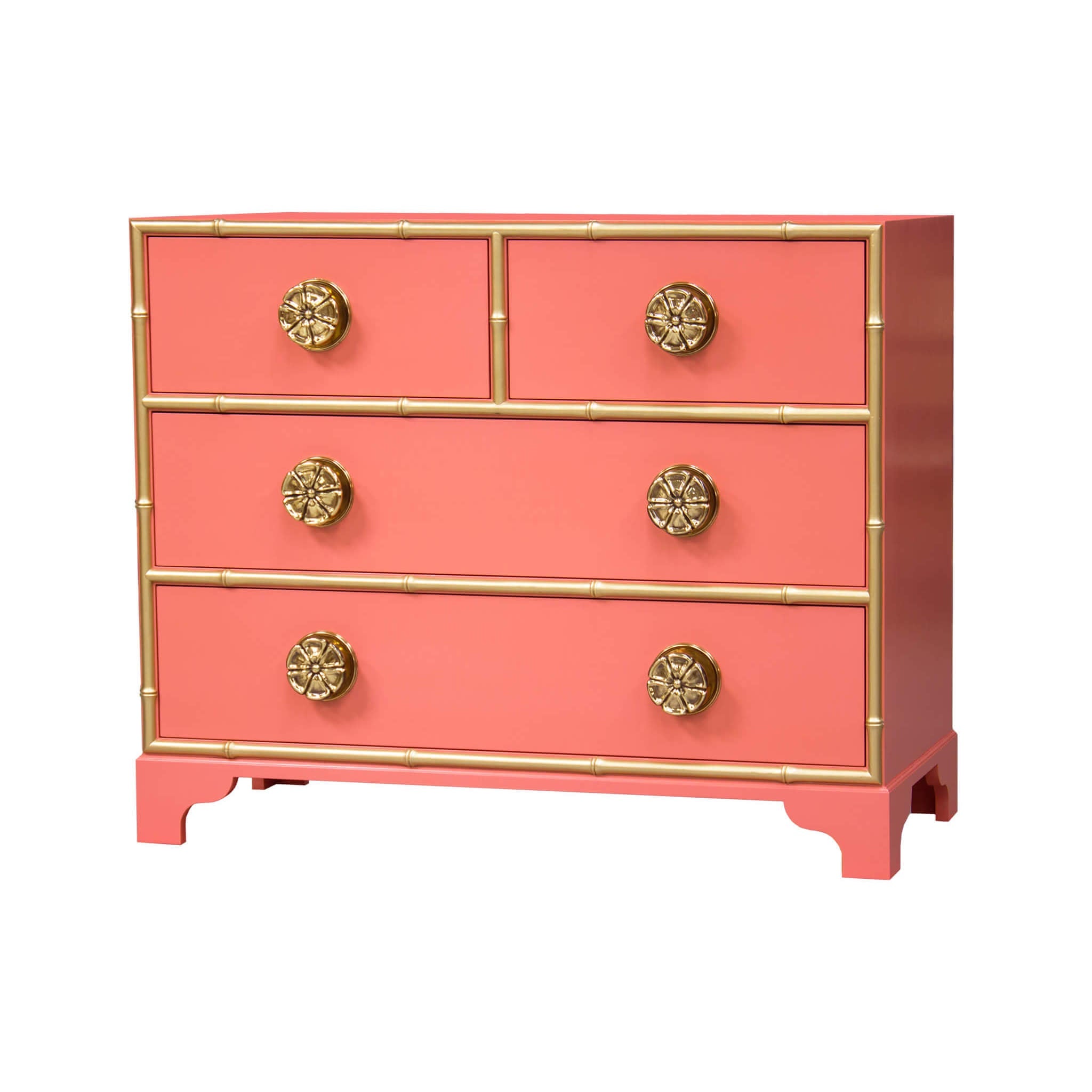 Coral dresser with gold accents and ornate knobs.