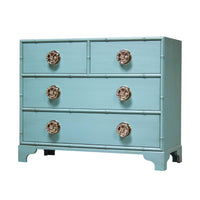 Light blue dresser with matching knobs and accents.