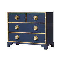 Navy dresser with gold accents and ornate knobs.