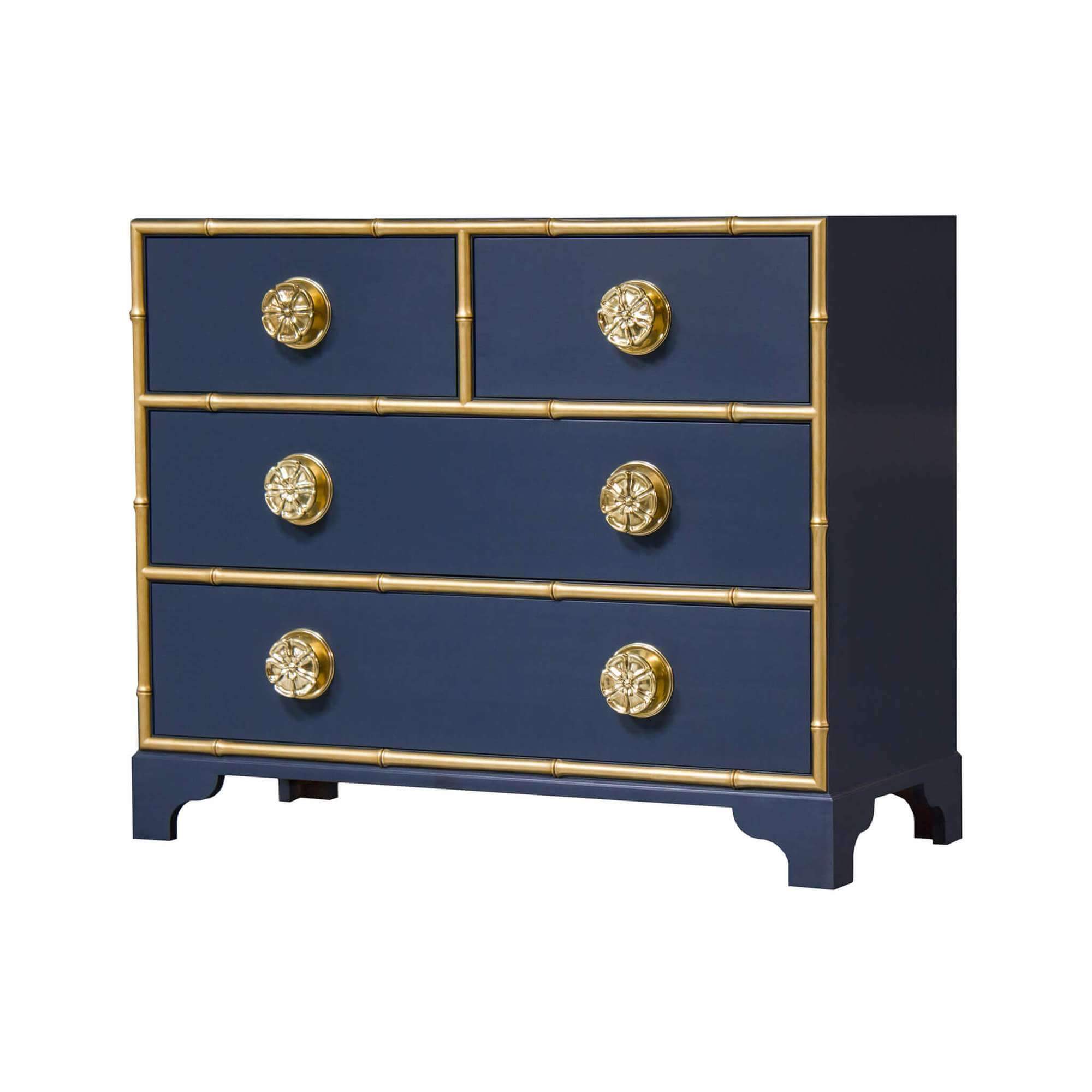 Navy dresser with gold accents and ornate knobs.