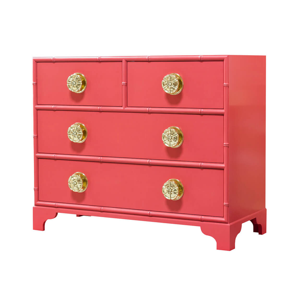 Pink dresser with gold accents and ornate knobs.