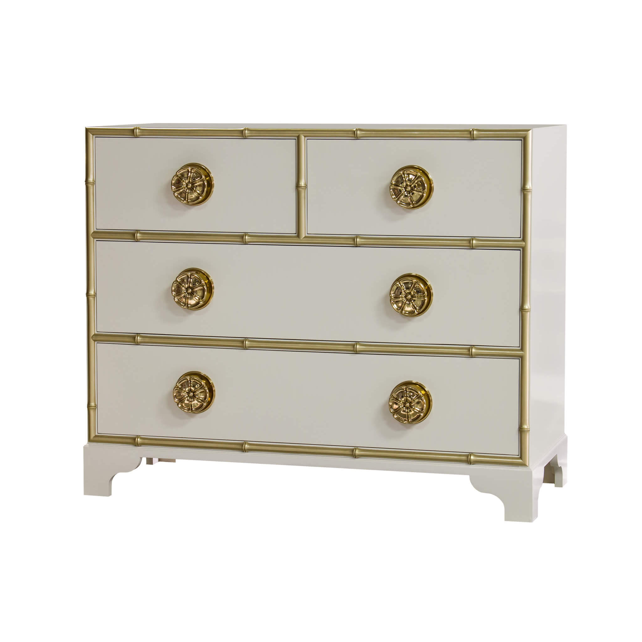 White dresser with gold accents and ornate knobs.